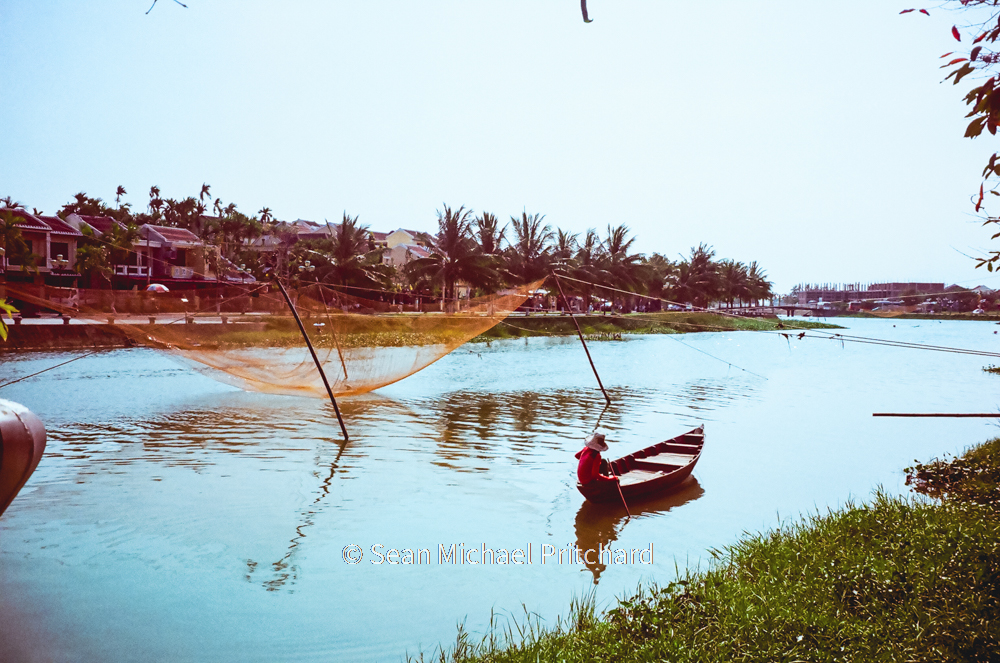 fisherman fishing boat river vietnam