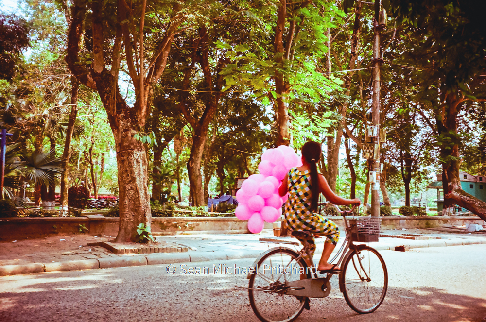 retro girl bike balloons vietnam
