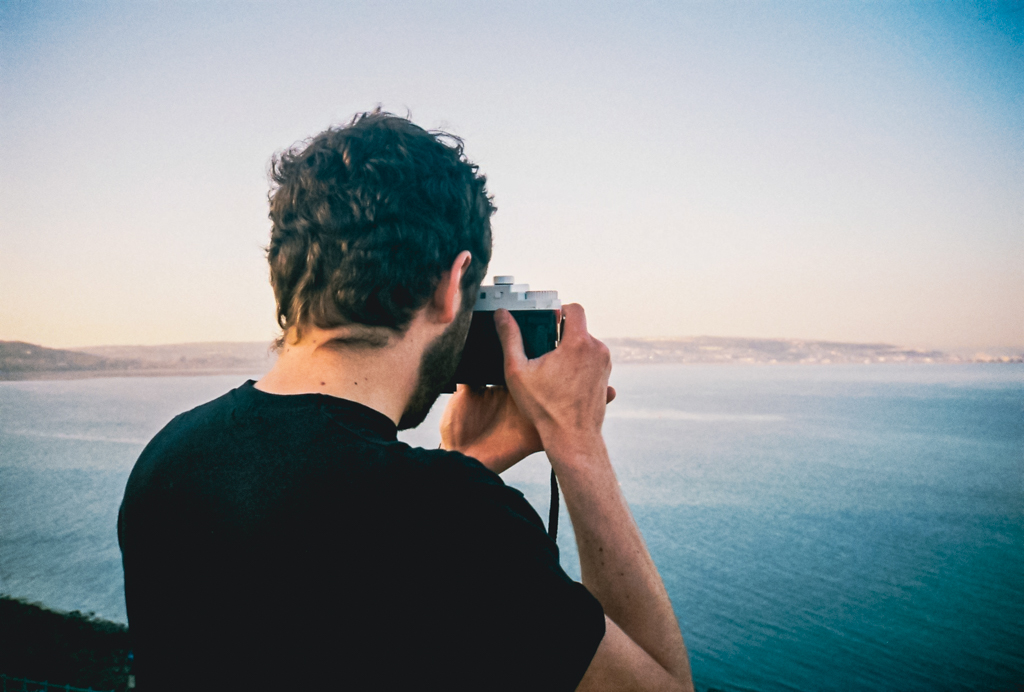 person using retro camera