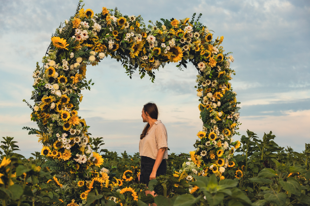 girl at the rhossili sunflowers