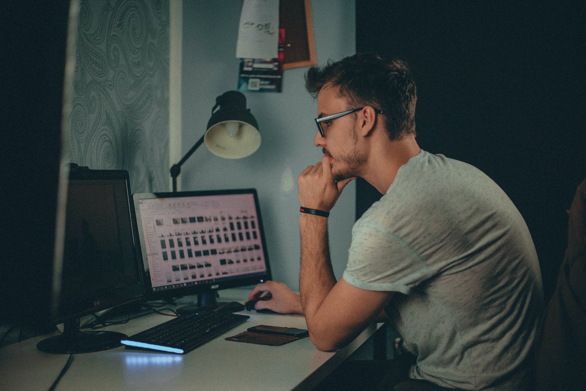 man using computer sitting on chair