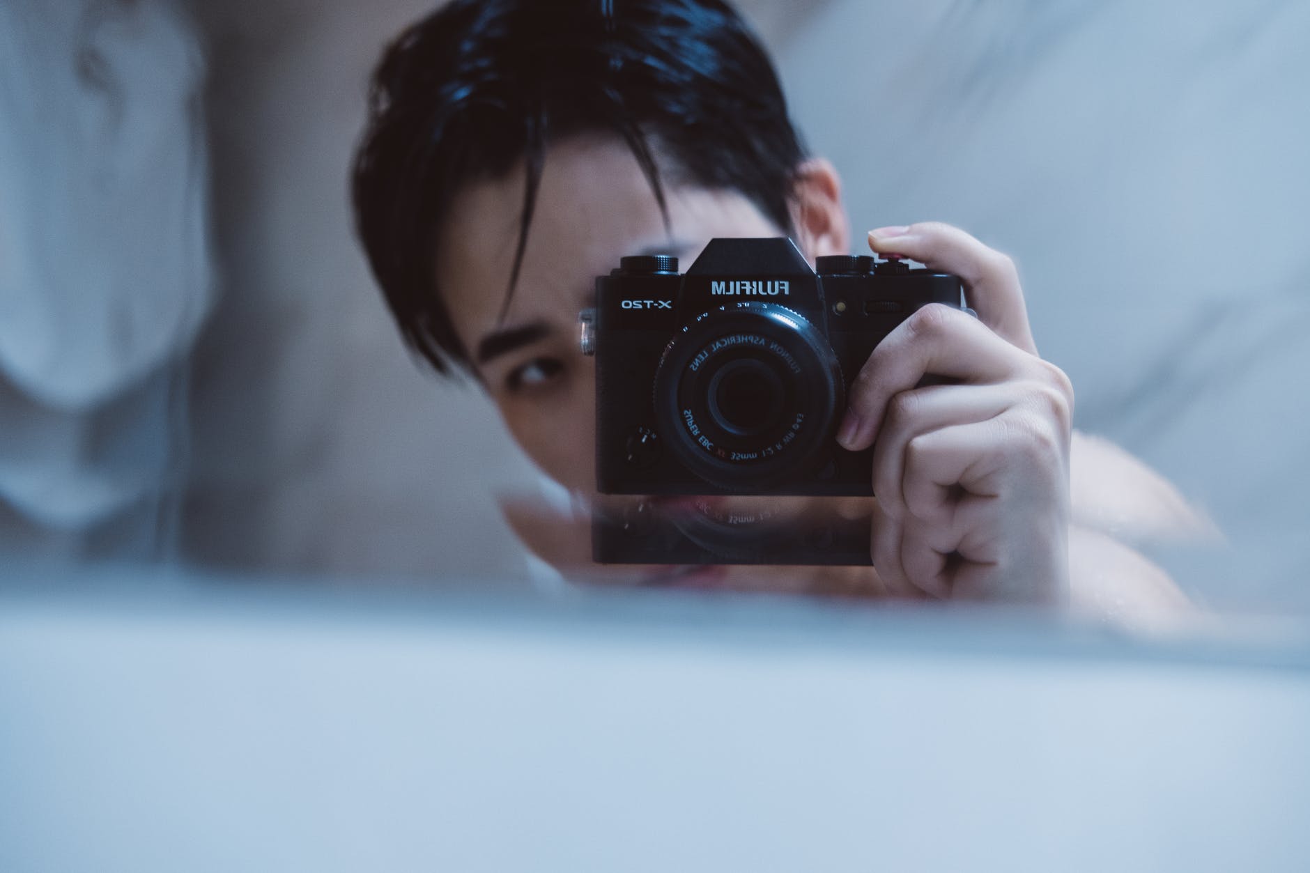 man holding fujifilm camera